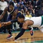 01/12/15: Boston, MA: The Celtics Jared Sullinger dives as he tries steal the ball from the Pelicans Jrue Holiday in the first quarter. The Boston Celtics hosted the New Orleans Pelicans in a regular season NBA game at the TD Garden. (Globe Staff Photo/Jim Davis) section:sports topic:Celtics-Pelicans