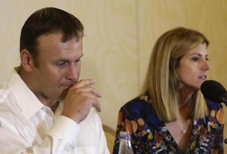Former Miami Dolphins fullback Rob Konrad and his wife Tammy spoke with the media Monday to discuss his ordeal of swimming 9 miles to shore after he fell off his boat while fishing last week off the South Florida coast. (AP Photo/Lynne Sladky)
