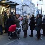 The latest edition of French satirical magazine Charlie Hebdo drew long lines at a kiosk on a Paris street on Wednesday.