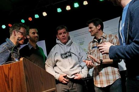 Surrounded by Guster members, Mayor Martin J. Walsh donned a band sweatshirt after declaring Thursday to be a day in their honor.
