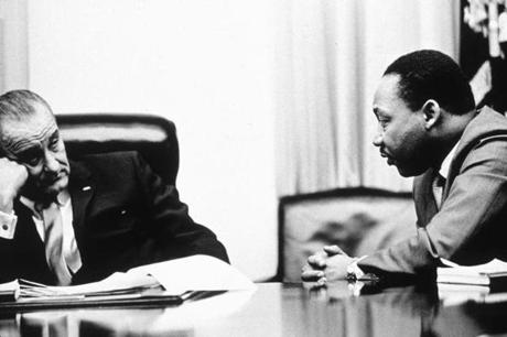 President Lyndon B. Johnson discusses the Voting Rights Act with Martin Luther King Jr. in 1965.
