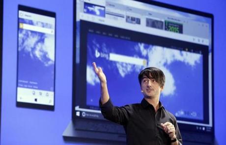 Microsoft's Joe Belfiore, corporate vice president of Operating Systems Group, speaks at an event demonstrating new features of its flagship operating system Windows at the company's headquarters Wednesday, Jan. 21, 2015, in Redmond, Wash. Executives demonstrated how they said the new Windows is designed to provide a more consistent experience and a common platform for software apps on different devices, from personal computers to tablets, smartphones and even the company's Xbox gaming console. (AP Photo/Elaine Thompson)
