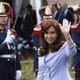 Argentina's President Cristina Fernandez de Kirchner waves while arriving for the Southern Common Market (MERCOSUR) trade bloc annual presidential 47th summit in Parana, north of Buenos Aires, December 17, 2014. REUTERS/Enrique Marcarian (ARGENTINA - Tags: POLITICS)