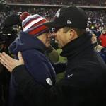 Bill Belichick (left) and Ravens coach John Harbaugh met after their AFC Divisional playoff game Jan. 10 at Gillette Stadium.