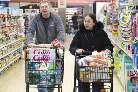  At right, Cheryl and Bill Keough of South Boston were among many stocking up for the concoming storm.
