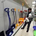A shopper buys a shovel at ACE Hardware in Winthrop.