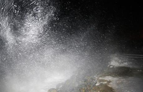 High winds whipped up snow during high tide on Plum Island.
