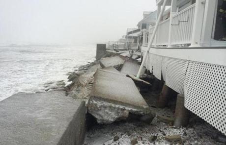 In Marshfield, police reported that heavy surf washed out a sea wall.
