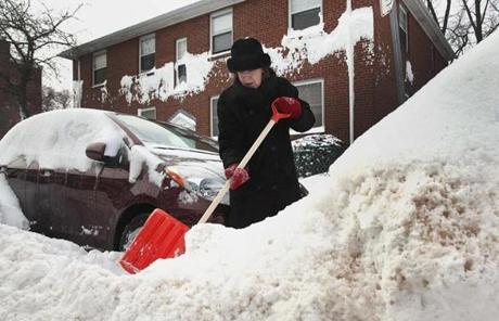 Southie residents worked to shovel out their cars.
