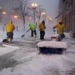 Crews cleared snow on Boylston Street early Tuesday.