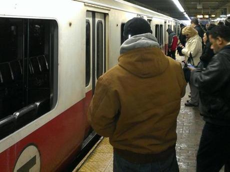 Bystanders kicked in windows to help passengers out of a smoke-filled Red-Line train at Quincy Station.
