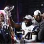 Darrelle Revis celebrated with the Lombardi Trophy after the game.