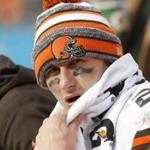 Cleveland Browns' Johnny Manziel (2) on the bench during the second half of an NFL football game against the Carolina Panthers in Charlotte, N.C., Sunday, Dec. 21, 2014. The Panthers won 17-13. (AP Photo/Bob Leverone)