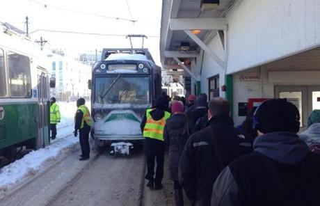 MBTA officials at Lechmere let riders get onto a train to stay warm.
