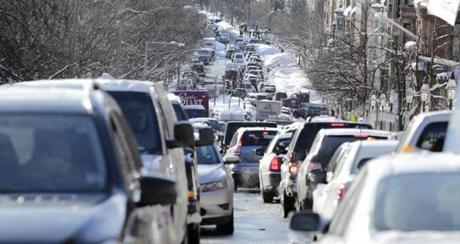 Cars were gridlocked on Beacon Street in Boston on Tuesday.
