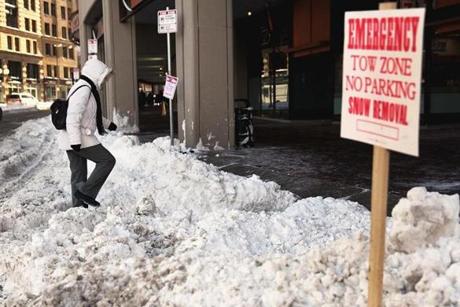 A woman slogged through the snow on Cambridge Street near City Hall in Boston on Tuesday.
