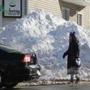 South Boston, MA., 01/29/14,The Blizzard of 2015 has passed through leaving giant snow mounds at the ends of many streets in South Boston. This was East Fourth and Dorchester. Suzanne Kreiter/Globe staff