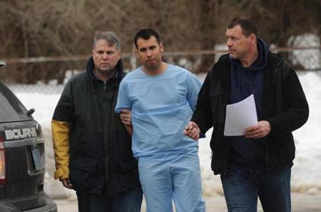 Adrian Loya of Virginia, center, was brought into Falmouth District Court Thursday afternoon. 
