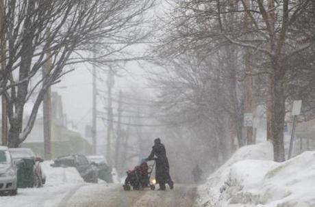 02/05/2015 - Medford, MA - Pedestrians battled snow-clogged streets and sidewalks again after yet another snow storm hit the region. Photo by Dina Rudick/Globe Staff.
