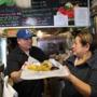 Tacqueria Casa Real owner Ricky Reyes, with his mother, Elena, said it is hard to keep taco prices low.