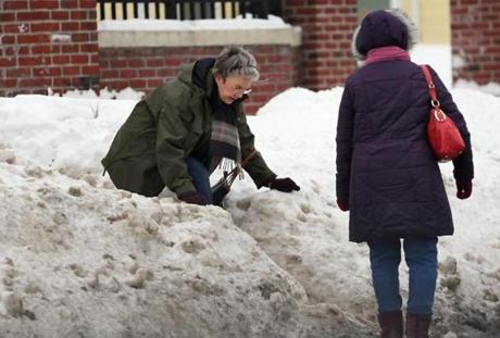 Pedestrians struggled with snow on Morton Street in Boston Saturday.
