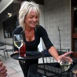 Janice Santarpio served pre-dinner wine to a table outside Rosaria's Steakhouse in Saugus last summer.
