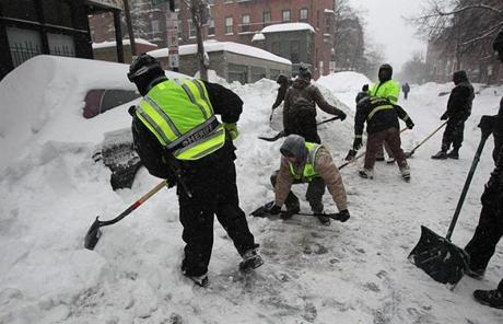 Crews were digging out handicapped spots in the city.

