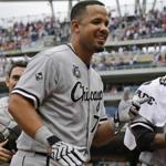 FILE - This July 27, 2014, file photo shows Chicago White Sox first baseman Jose Abreu walking to the dugout before the start of a baseball game against the Minnesota Twins in Minneapolis. Abreu was a unanimous winner of the AL Rookie of the Year award, Monday Nov. 10, 2014. (AP Photo/Ann Heisenfelt, File)