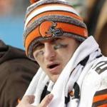 FILE - In this Sunday, Dec. 21, 2014, file photo, Cleveland Browns quarterback Johnny Manziel (2) sits on the bench during the second half of an NFL football game against the Carolina Panthers in Charlotte, N.C. An advisor for Manziel said in a statement released by the team Monday, Feb. 2, 2015, that Manziel has decided to enter treatment for an unspecified condition. (AP Photo/Bob Leverone, File)