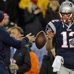 Patriots QB Tom Brady was tossed a football prior to the AFC title game in January.
