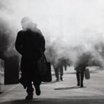 A pedestrian walked through the exhaust of a steam vent during a frigid morning Friday in New York.