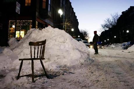 A wooden chair was at work as a space saver in the South End in late January.
