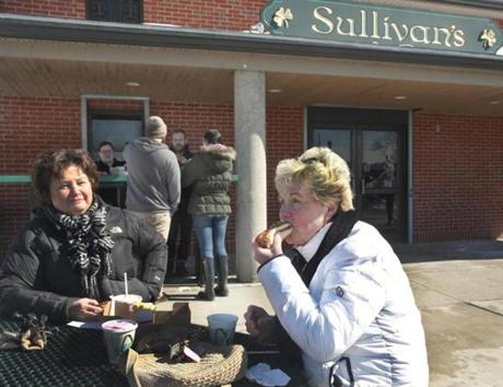 Ellen Shultz of South Boston and Doris Rooney of Weymouth ate hot dogs at Sullivan's on Saturday. 
