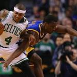 Boston?s Isaiah Thomas battled Golden State?s Harrison Barnes for the basketball during the second quarter.