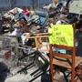 Seized possessions litter the space saver graveyard in Somerville.