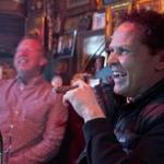 Actor Kevin Chapman enjoying a cigar with friends at Stanza Dei Sigari in the North End.