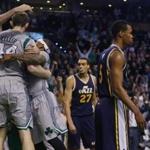 Celtics players celebrated after Tyler Zeller's winning shot. 