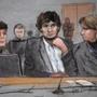 A courtroom sketch depicts Dzhokhar Tsarnaev (center) during his trial on Thursday between defense attorneys Miriam Conrad (left) and Judy Clarke (right). 