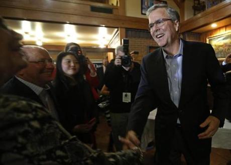 Jeb Bush greeted attendees at a fundraiser for U.S. Rep. David Young in Urbandale, Iowa, Friday.
