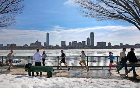 Several people ran along the Charles River Wednesday as temperatures reached into the 50s.
