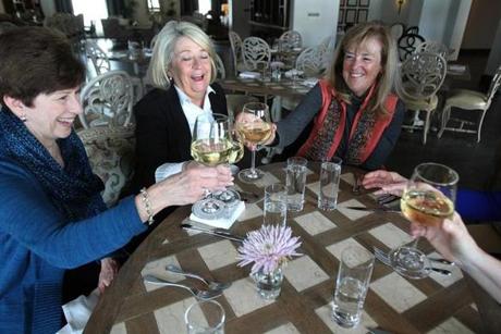 From left, friends Anne O?Neill, Claire Loughlin, and Nancy Betz dine at the Mirbeau Inn & Spa at The Pinehills in Plymouth.  The Pinehills offers developments for a variety of ages.
