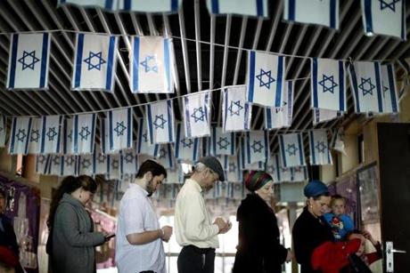Israeli voters waited in line at a polling station in the West Bank settlement of Kiryat Arba.
