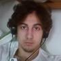 Prosecutors in the trial of Dzhokhar Tsarnaev entered into evidence on Monday a photo of Tsarnaev and Islamic militant propaganda dating back to at least January 2012 found on Tsarnaev?s computer and other electronic devices.