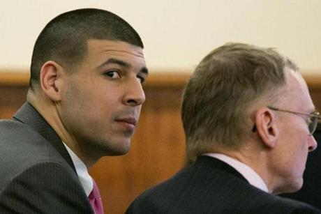 Aaron Hernandez (left) listened during a motion regarding jail phone recordings during his murder trial.
