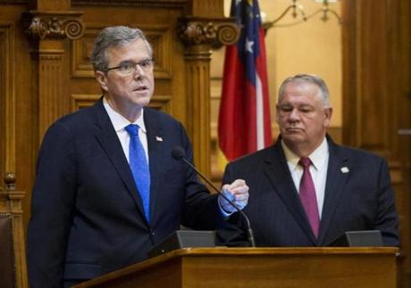 Jeb Bush spoke to state lawmakers in Georgia on March 19 as House Speaker David Ralston looked on.
