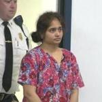Burlington resident Pallavi Macharla was escorted into Middlesex Superior Court for her arraignment Friday.