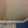 Water that slipped under an ice dam stained this bedroom ceiling.
