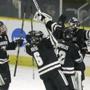 Providence's, from the left, Noel Acciari, Tom Parisi, Stefan Demopoulos, and goaltender Jon Gillies, celebrate after defeating Denver in the NCAA East Regional hockey tournament, Sunday, March 29, 2015, in Providence, R.I. (AP Photo/Steven Senne)