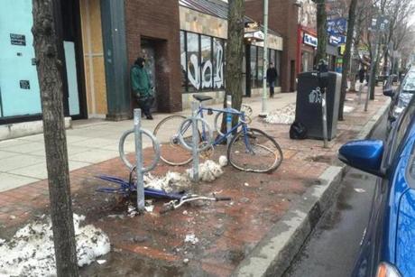 Damaged bikes and bike racks could be seen in Cambridge.
