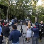 Members of the media wait outside the home of Andrew Getty in the Hollywood Hills area of Los Angeles.